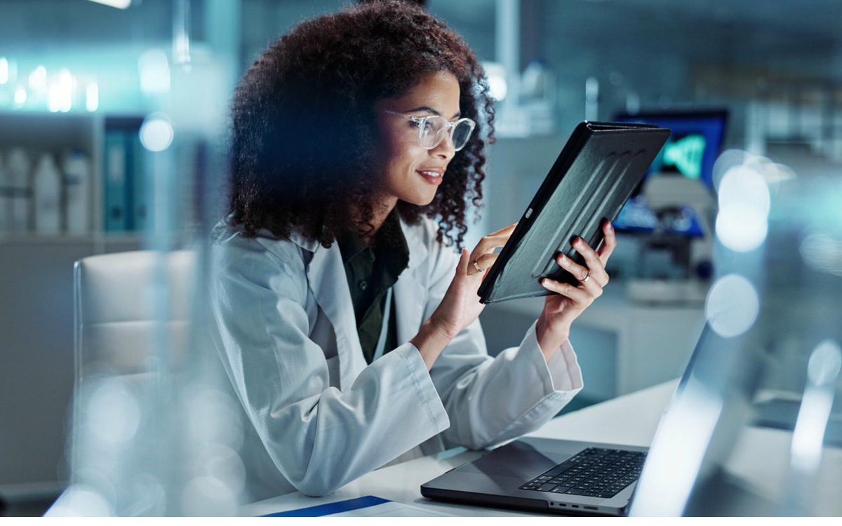 A clinician reviewing lab results on a tablet