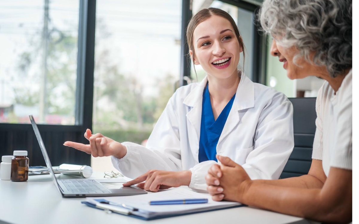 A clinician explaining a treatment plan across a desk